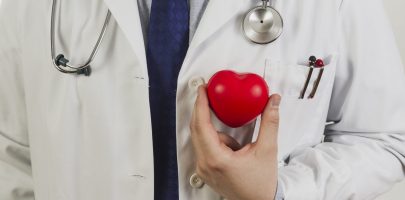 doctor-showing-plastic-heart-scaled